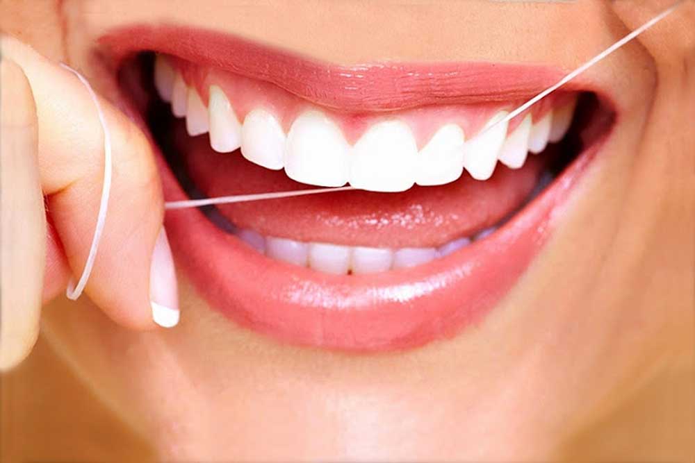 Why is flossing important? Sedation and Implant Dentists